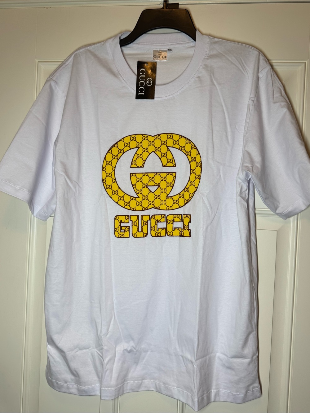 White Short Sleeve T-Shirt with Yellow Print. No Brand.